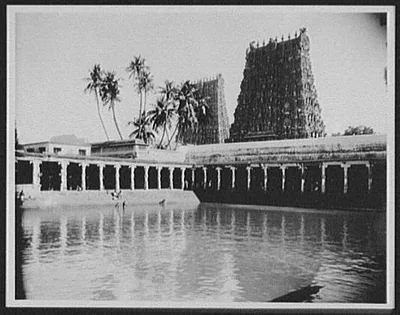Madura - the bathing tank, showing golden pagoda and south tower of…, Madurai, India, 1895