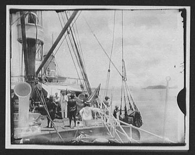 Unloading cargo from deck of steamer, China, 1895
