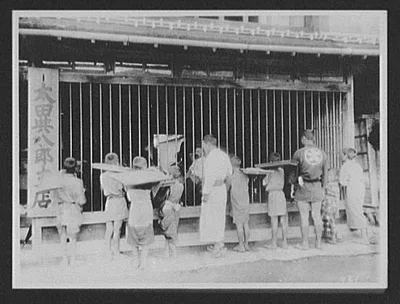 Miyajima - Japanese men and boys looking into Inn where WTC [i.e.…, Miyake Island, Japan, 1895