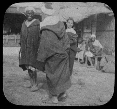 Five men in village street, India, 1895