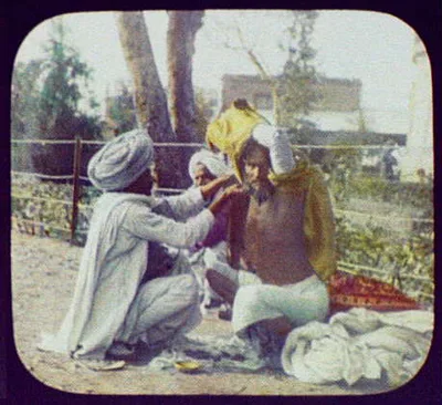 Hindu devotee - 3 men squatting beside barbed-wire fence, India, 1895