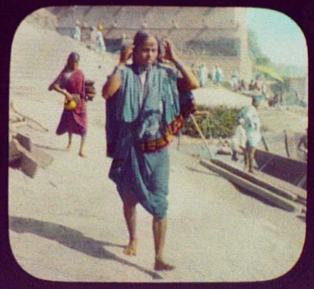 Benares - woman walking; stone steps in background, India, Varanasi, 1895