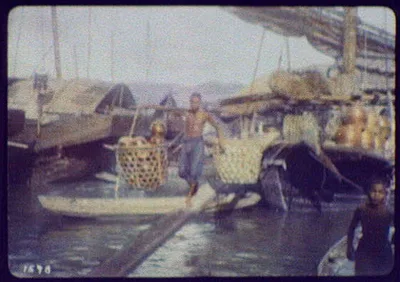 Merchants trading from large riverboats, India, 1895