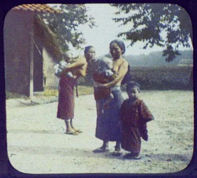 Two bare-breasted mothers holding babies, Java, Indonesia, 1895
