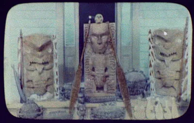 Maori wood carvings, including large and small idols and canoe paddles, New Zealand, 1895