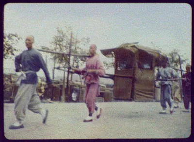 Four men carrying sedan chair, China, 1895