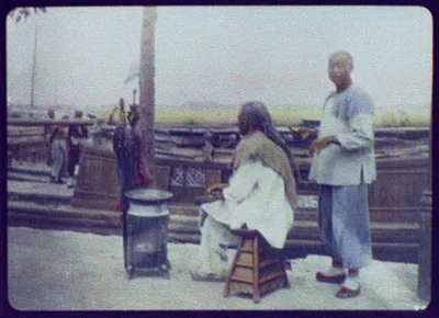 Outdoor hairdressing parlor, China, 1895