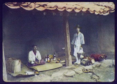 Seoul - 2 Koreans with wine, biscuits & baggage preparing meal at a…, Seoul, Korea, 1895
