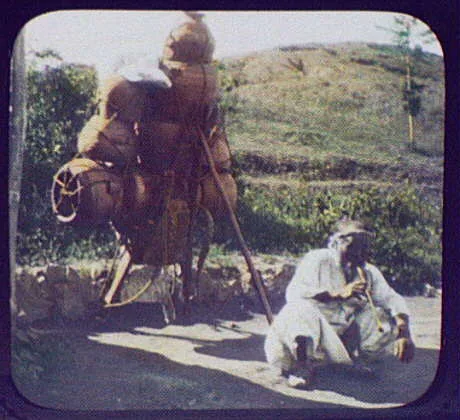 A potter taking his wares to market sits for his picture, Korea, 1895