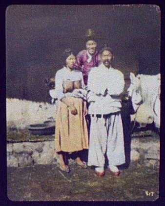 Two men and bare-breasted woman, Korea, 1895