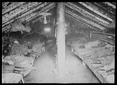 Convicts' sleeping quarters inside sod-covered house, Siberia, 1895