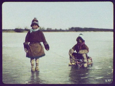 Two Goldi boys with sled on ice, Russia, China, Amur River, 1895