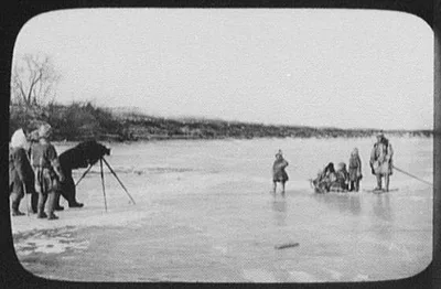 Man under shroud behind camera on tripod, photographing Goldi family…, China, Amur River, Russia, 1895