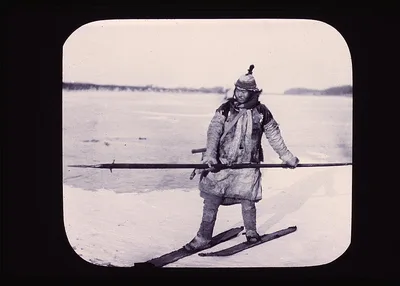 Goldi hunter on skis on ice, holding long spear, China, Amur River, Russia, 1895