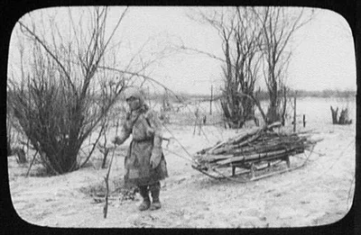 Goldes woman pulling firewood sledge, Siberia, 1895