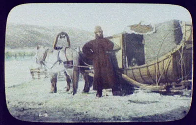 Man standing beside horse-drawn carriage sledge, Siberia, 1896