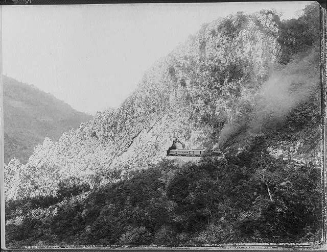 [Train emerging from tunnel, Temasopa Canon, Mexico], 1884