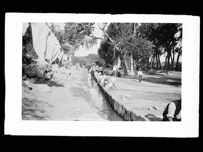 Bathing scene at hot springs acequia, Aguascalientes (State), 1880
