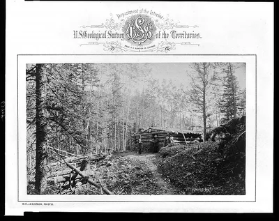 [Three men standing in front of log cabin at camp for U.S. Geological…, Rocky Mountains, 1872